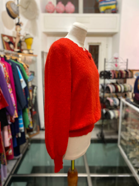 Maglione rosso bottone