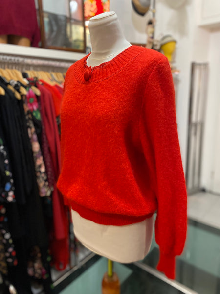 Maglione rosso bottone